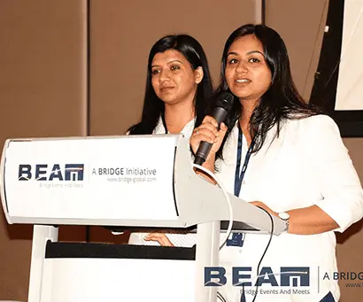 TechWhizz gallery image showing two presenters speaking at a podium