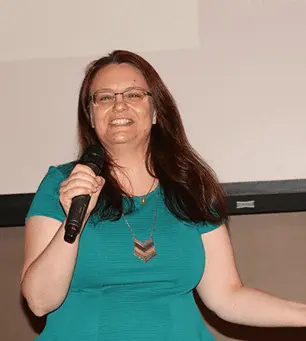 TechWhizz gallery image showing a speaker holding a microphone
